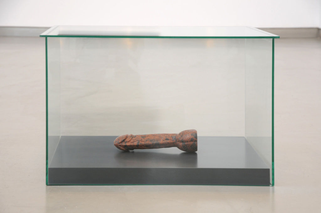 Untitled (date unknown) (hand carved penis in glass vitrine)